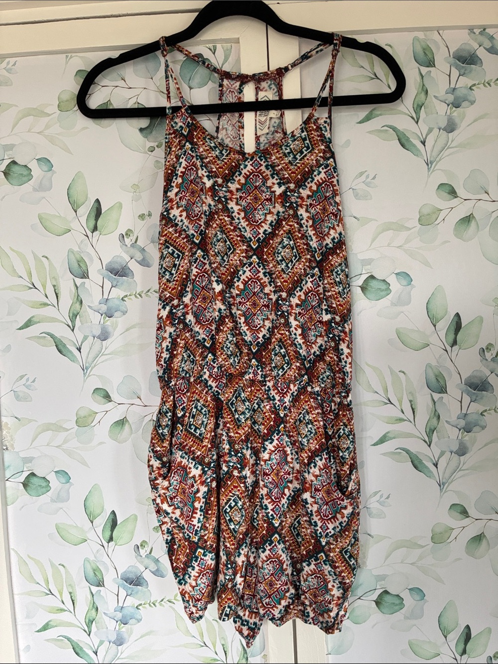 Pink Rose romper with pockets.  Sexy racer back with adjustable straps